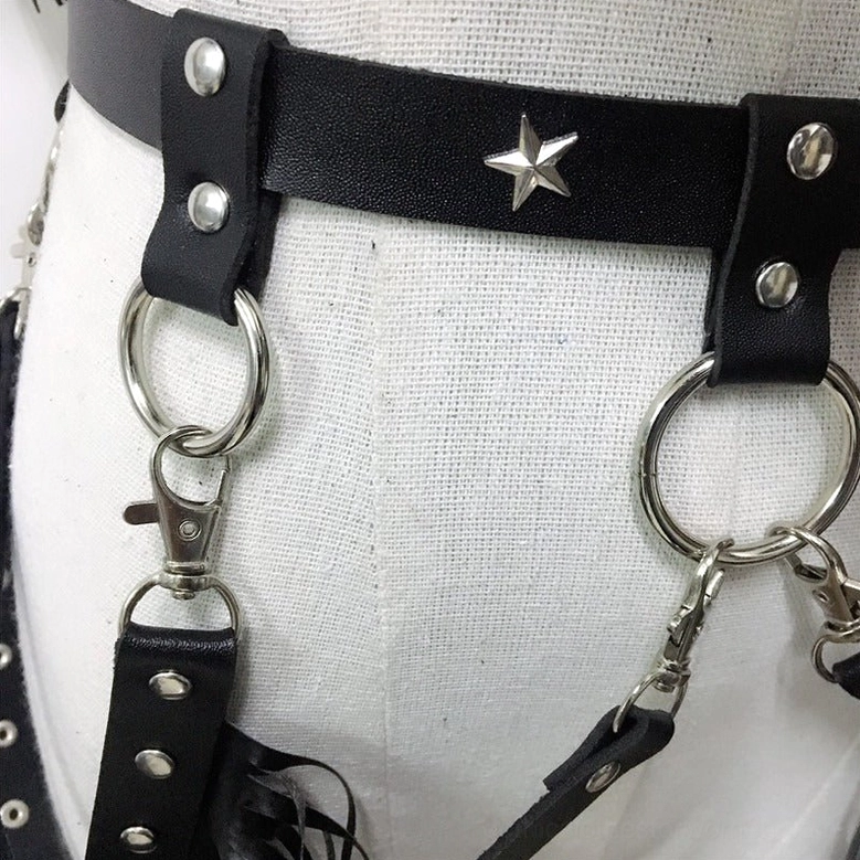 Black leather gothic harness with decorative chains, metal buckles, and stainless steel D-ring attachment points for rave festivals