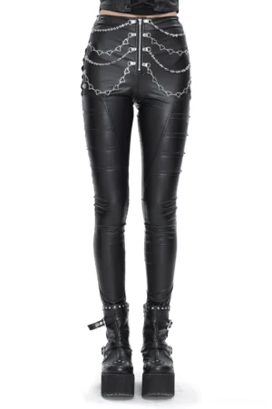 Women's black gothic faux leather skinny pants with heart chain accents, front view on model