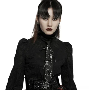 Gothic choker tie with skull lock pendant worn with black goth blouse featuring puffed jacquard sleeves, front half-body view on East Asian model