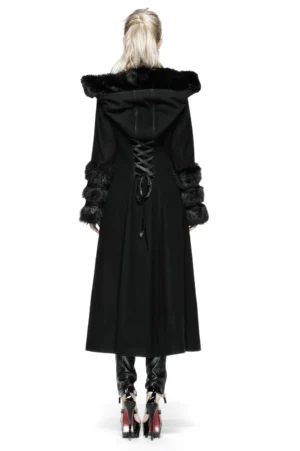 Gothic winter coat back view displaying lace-up corset back design and fur cuffs on model