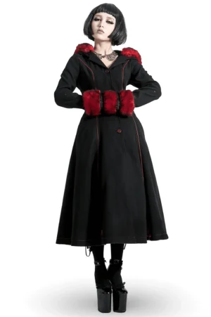 Black gothic long coat with red faux fur trim front view on model with short bob haircut, featuring dramatic red fur hood and lace-up back design
