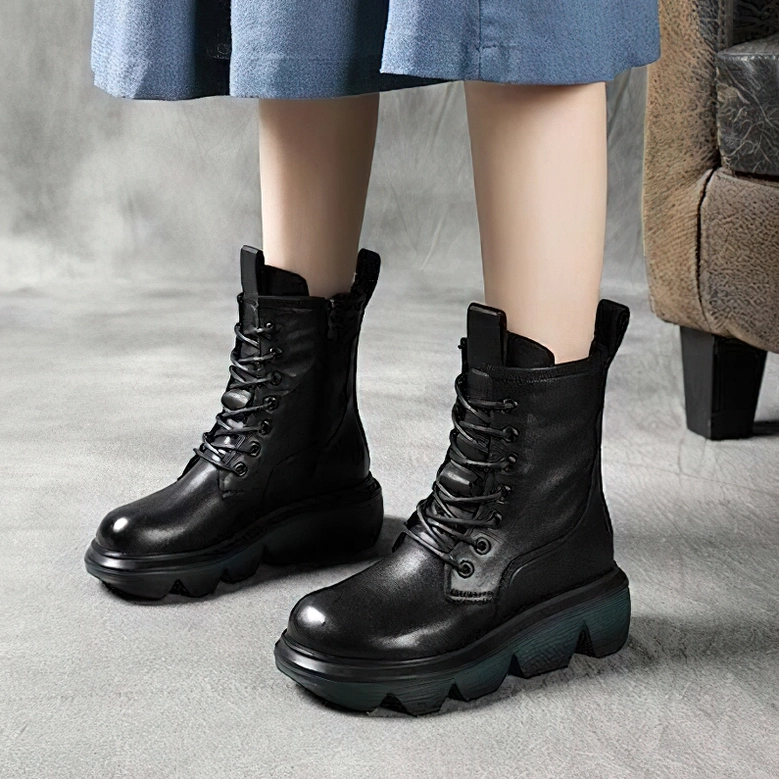 Black gothic platform combat boots detail shot showing genuine leather quality and lug sole grip