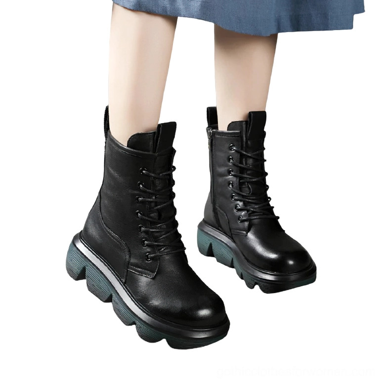 Black leather gothic platform combat boots pair, side profile showing thick lug sole and lace closure