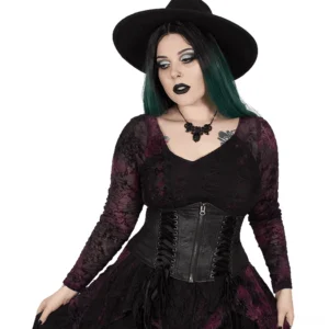 Black gothic corset waist belt worn by model in front three-quarter view, featuring matte black faux leather and metal zipper closure with lace-up side details