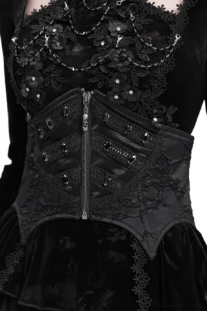 Black gothic lace-up corset belt with front zipper worn over velvet top, showing front view with floral lace details and gem embellishments