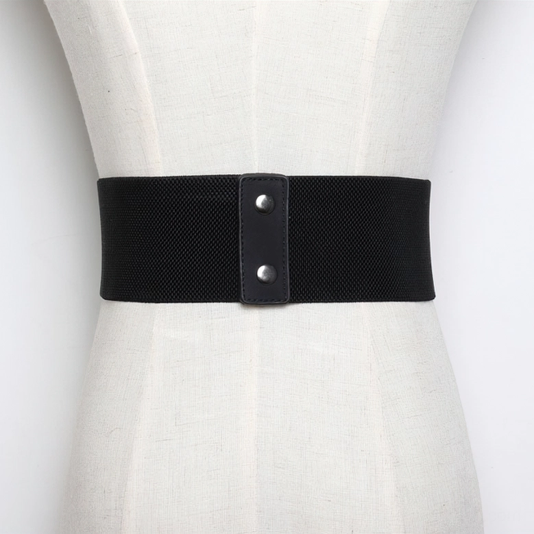 Wide black gothic corset belt worn on dress form showing waist-defining silhouette and decorative buckle arrangement