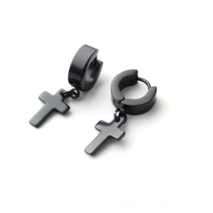Black matte gothic cross dangle huggie earrings top-down studio view