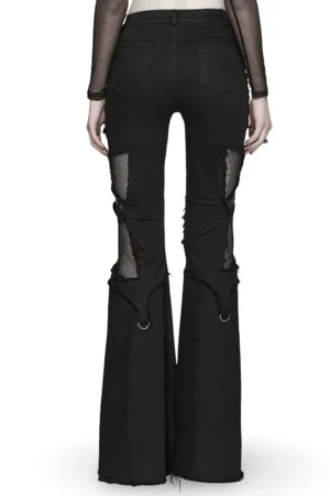 Black gothic cross flare jeans back view with fishnet panels and leather cross details on model