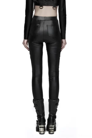 Black gothic leggings rear view showing patch pockets and glossy fabric, styled with chunky combat boots