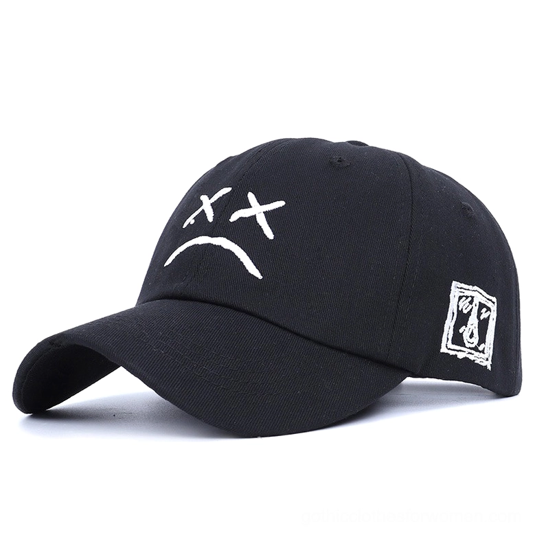 Black gothic crying face baseball cap with embroidered sad expression, front studio view, unisex dark aesthetic cotton hat with geometric patch detail