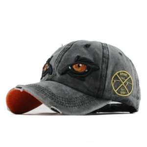 Black gothic eagle eye embroidered baseball cap front three-quarter view studio shot