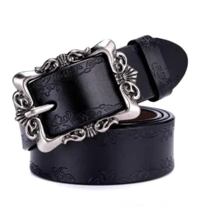 Black gothic leather belt with hand-embossed floral pattern and ornate silver buckle, studio view