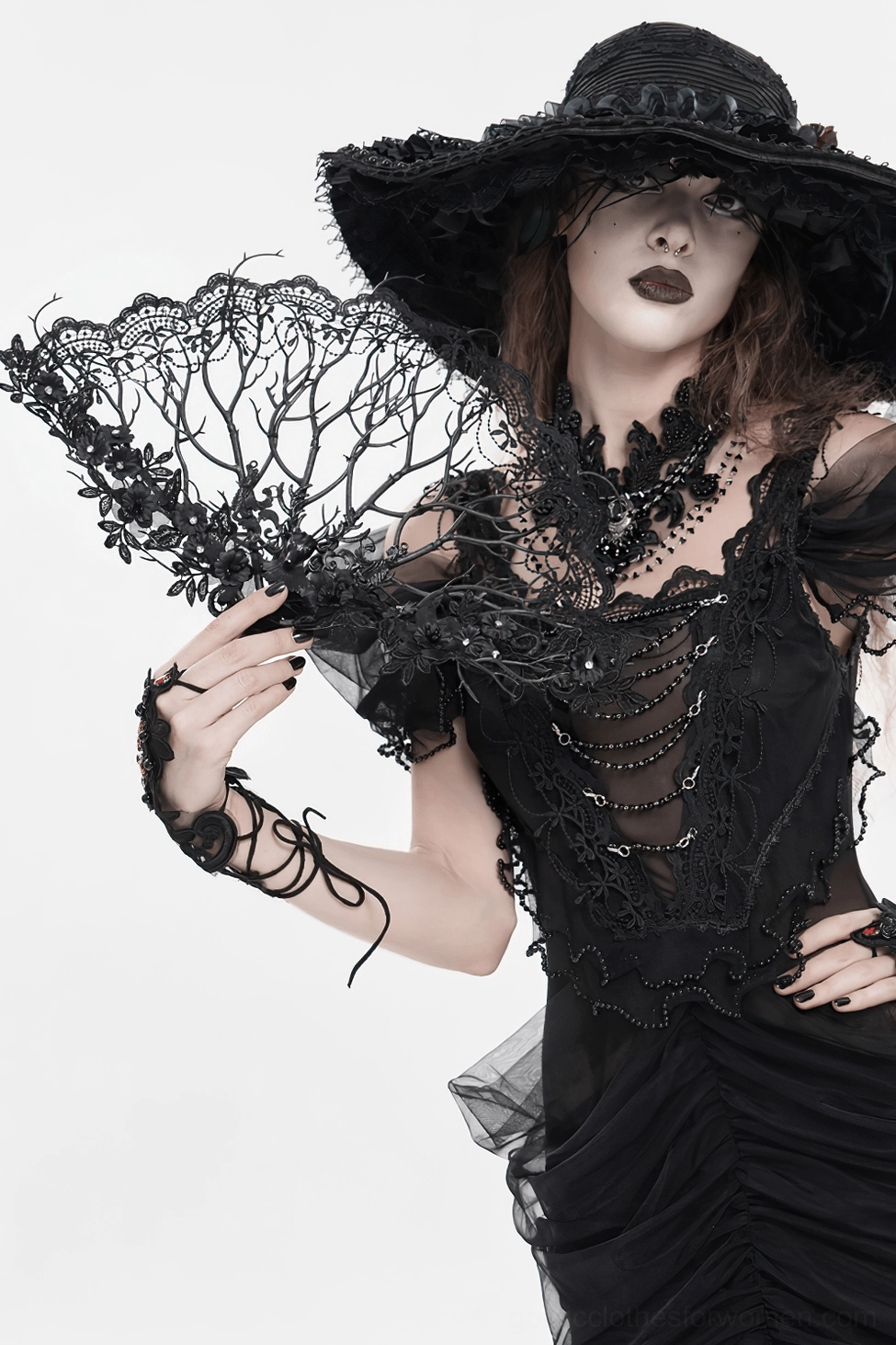 Black lace gothic hand fan with velvet-wrapped handle and floral embellishments capturing romantic dark aesthetic