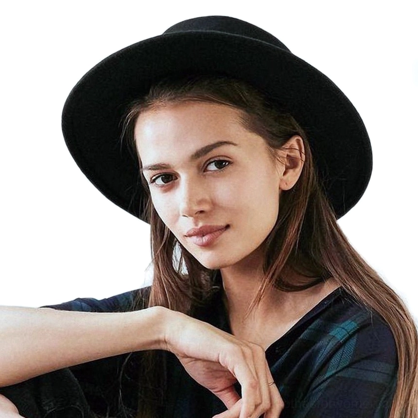 Black flat top wide brim gothic fedora hat worn by woman, front three-quarter view showcasing alternative fashion style