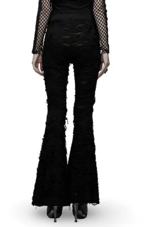 Black gothic flare pants with distressed frayed edges and bell bottom silhouette, rear full view on model