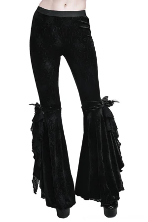 Black gothic flared velvet trousers with lace embroidery front 3/4 view showing ruffled lace feather trims on bell bottoms and embossed damask swirl texture