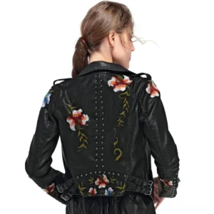 Black floral embroidered faux leather gothic motorcycle jacket back view on model - embroidered details, studded trim, adjustable waist belt