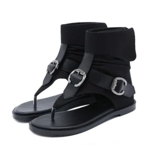 Black gothic gladiator flip flops with silver buckles and fold-over ankle cuff, overhead flat lay view showing thong toe design