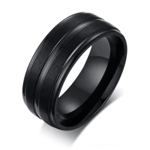 Black matte stainless steel gothic groove ring with polished interior, overhead view showing geometric design