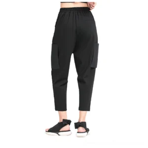 Black gothic cargo harem pants rear view demonstrating elasticated waistband and structured back cargo pockets