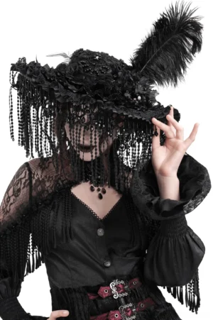 Front close-up of black gothic hat featuring intricate beaded face fringe, ostrich feather, and floral lace appliqués