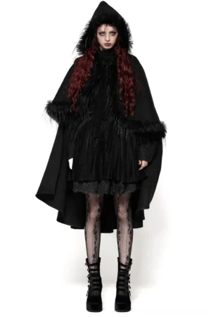 Gothic black hooded cape with faux fur trim worn by red-haired model in front three-quarter view