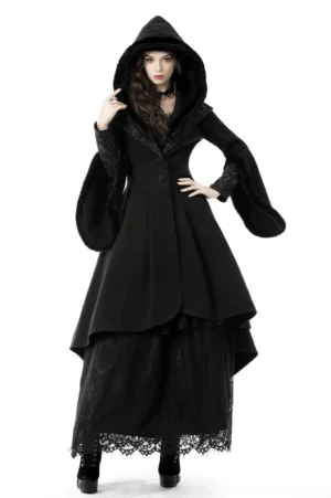Black gothic hooded cocktail coat with flared fur-trimmed sleeves front three-quarter view on model