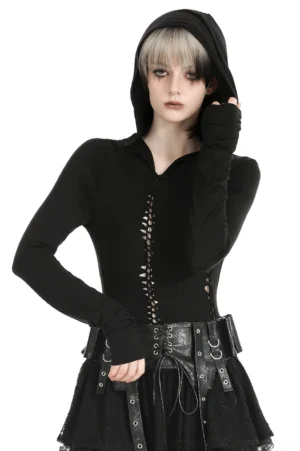 Black gothic hooded cutout top with thumb holes - front three-quarter view on model with two-tone hair, showing lace-up chest details and fitted silhouette