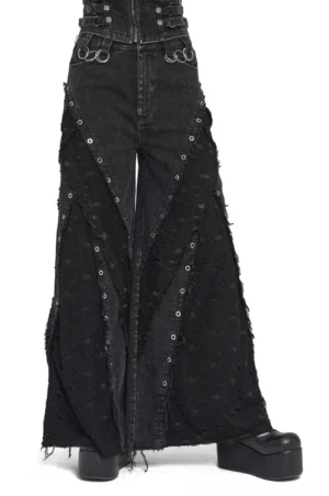 Black distressed wide-leg gothic jeans with metal eyelet mesh panels, worn with platform boots, front three-quarter view