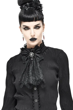 Black lace gothic bow tie with silver brooch worn by woman with retro updo - front view