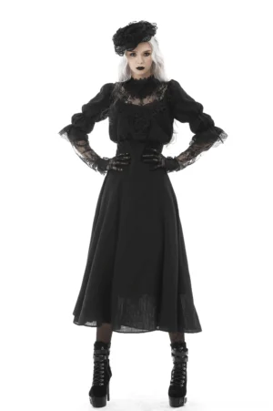 Black gothic lace bustier maxi dress front view on model with silver hair, showcasing sheer lace overlay and fitted bodice with dramatic cutout design