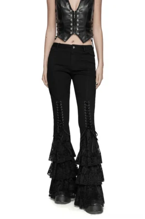 Black gothic lace flared pants with V-shaped drawstring front view on model showing tiered ruffled cuffs and slim-fitting silhouette