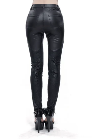 Rear view of black gothic faux leather leggings with lace appliqués on knees and calves, styled with platform heels