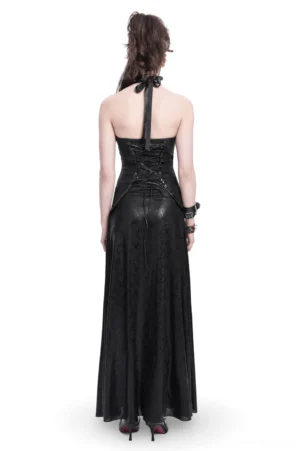 Back view of black gothic lace-up corset maxi dress with halter tie straps and adjustable lacing on female model