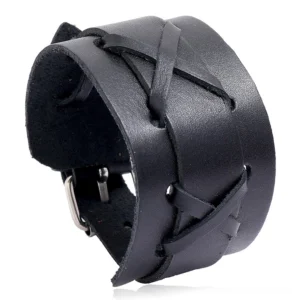 Black wide leather gothic cuff bracelet with cross-lacing and metal buckle, oblique top view on white background