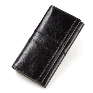 Black genuine leather long wallet clutch with horizontal stripe stitching details, displayed in studio on white background - gothic wallet for women