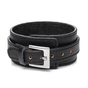 Black gothic leather wristband cuff bracelet with stainless steel hidden clasp, front view flat lay, adjustable punk style bracelet