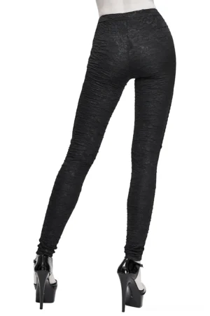 Gothic leggings rear view displaying ruched textured fabric, red lace detailing, elastic waistband and stud accents on model