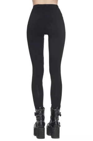 Back view of black gothic leggings with seamless design, modeled with punk platform boots on white background