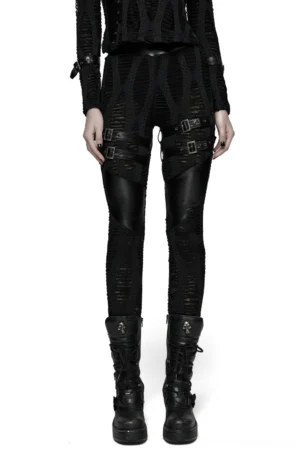 Black buckled gothic leggings with distressed hollow texture front view on model