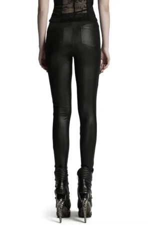 Full-length rear view of women's black gothic leggings with lace side panels, sheer waist design, and back pockets styled with platform boots