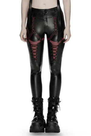Black faux leather gothic leggings with red mesh lace-up front and metal harness straps - front lower body view
