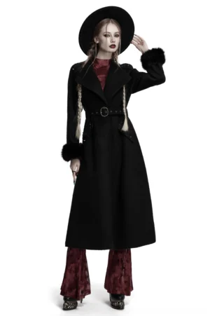 Black gothic long coat with detachable fur cuffs, ornate vintage belt, and studded baroque appliques, worn by model in front three-quarter view on white background