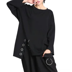 Black asymmetric gothic long sleeve pullover top with metal eyelets, worn by female model, three-quarter front view showing neck cutout and wide drop sleeves