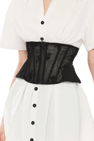 Black gothic mesh cincher corset with front zipper worn over white shirt, front half-body view showing structured waist definition and floral embroidered mesh panels