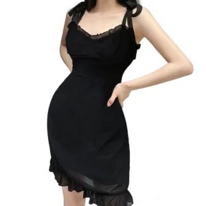 Black backless gothic mini dress with ruffled neckline and tie spaghetti straps on model, front three-quarter view