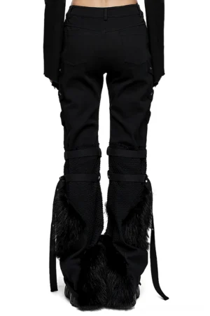 Black gothic trousers with side faux fur trim and adjustable knee loops - rear view on model