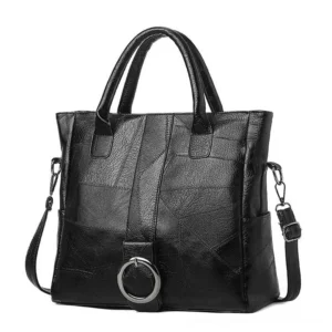 Black gothic patchwork PU leather tote bag with metal ring buckle front view