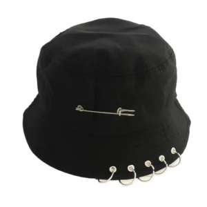 Black gothic pin ring bucket hat with metal safety pin crown decoration and silver ring trims, front studio view