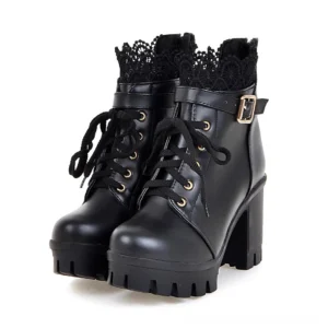 Black PU leather gothic platform ankle boots with ornate lace collar, metal buckle strap, and chunky block heel - front three-quarter view